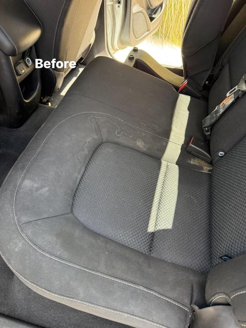 Stained and dusty cloth rear bench seat cushion before detailing (labeled 'Before')