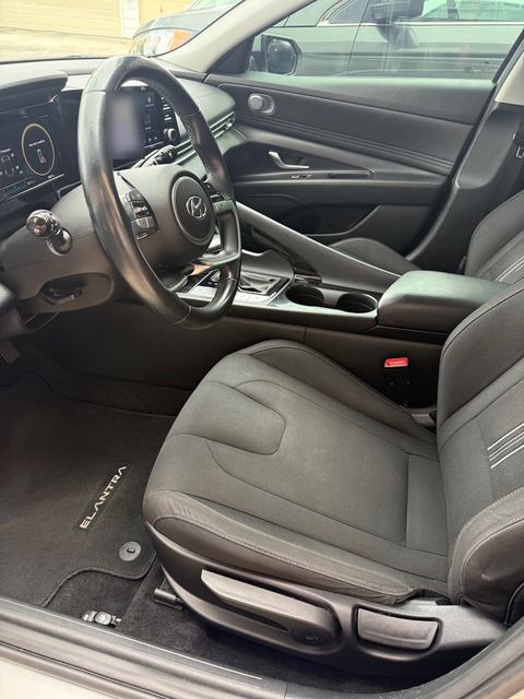 Hyundai Elantra front interior with driver's seat, steering wheel and dashboard